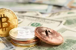 bitcoin pile top dolar bills